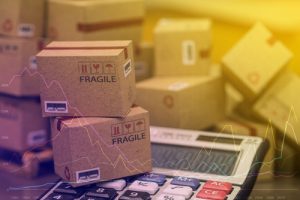 calculator and shipping cartons concept